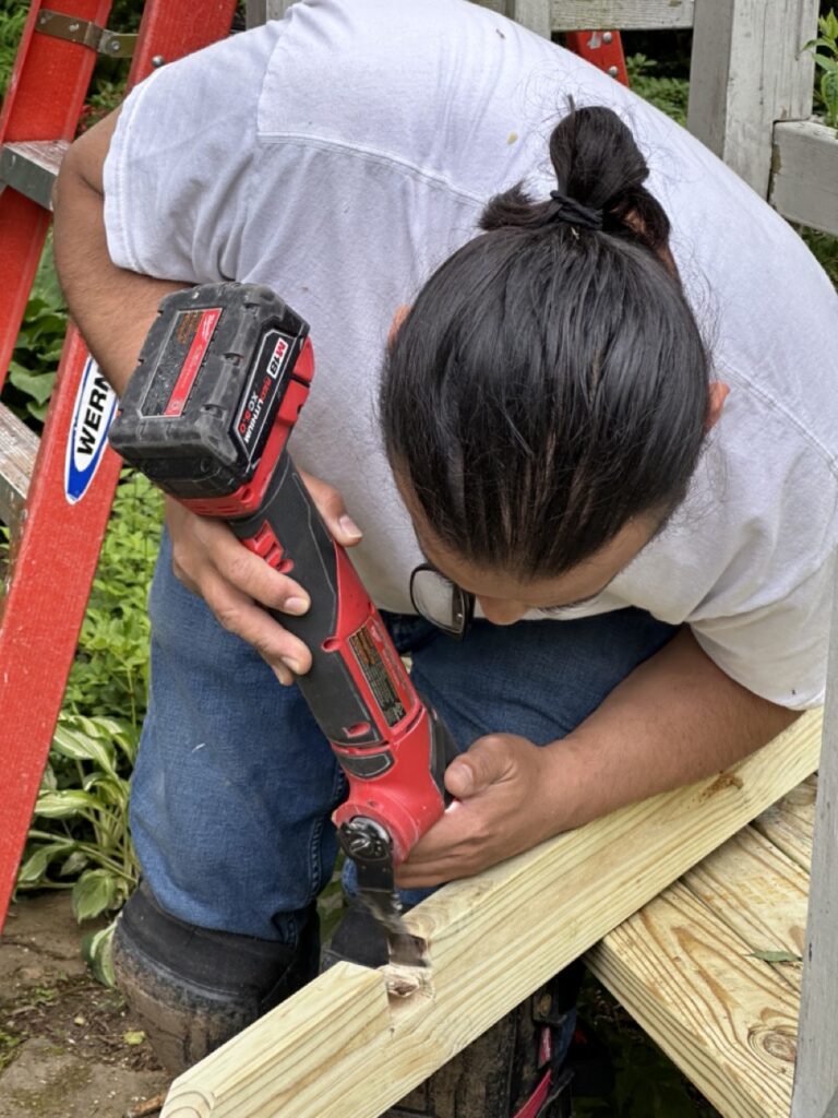 Expert handyman fixing some wood